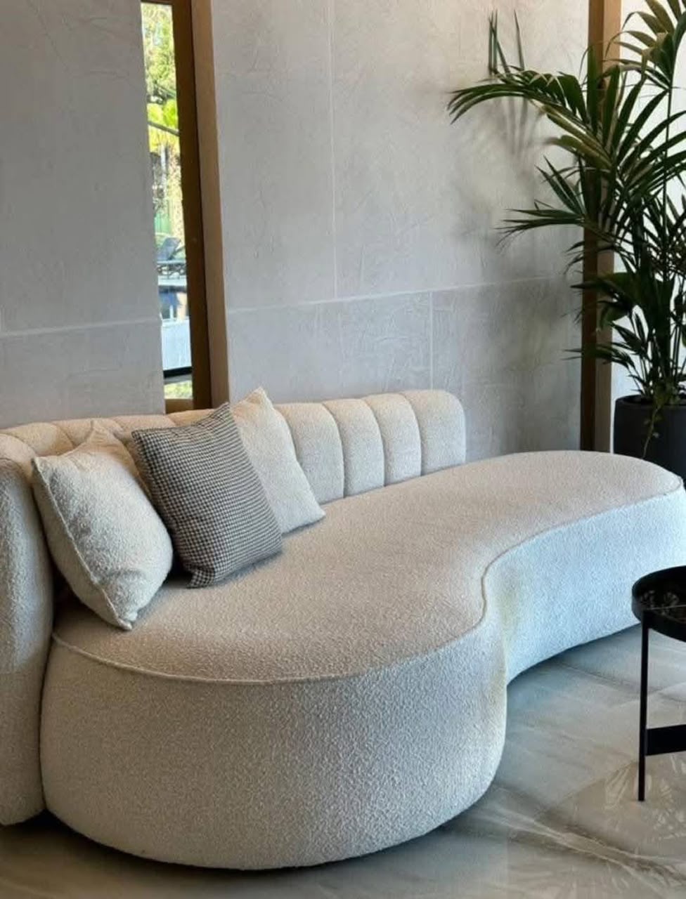 Kidney-shaped boucle sofa
